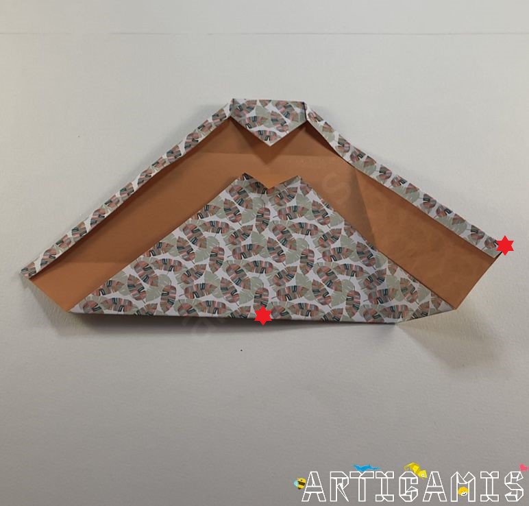 Step 9: Fold the bottom right stitch onto the middle line. Gather the two red dots.