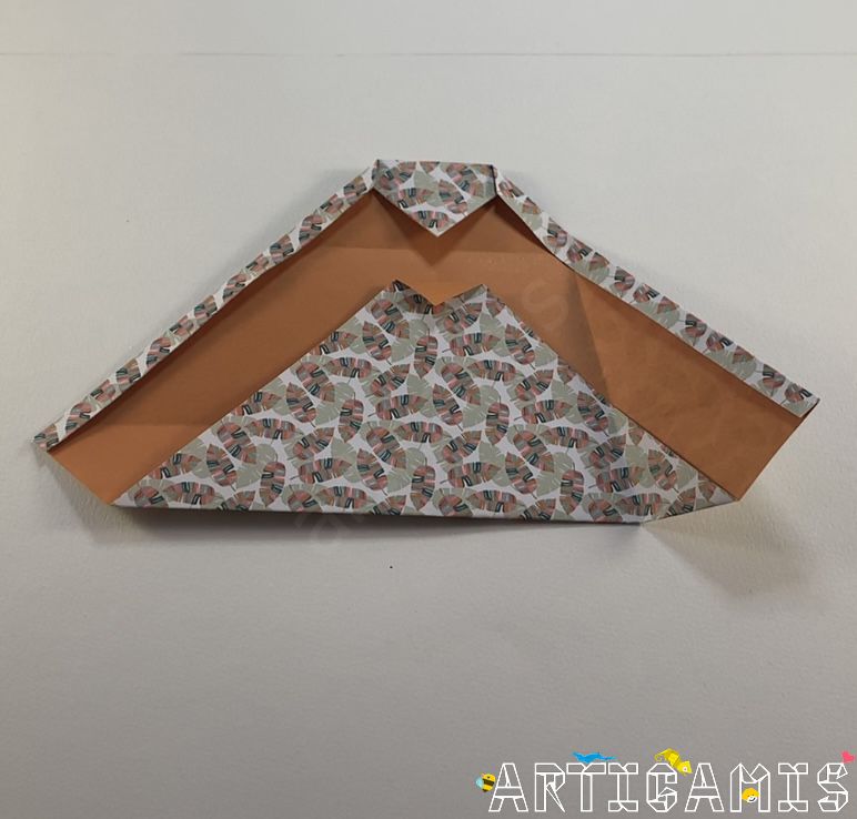 Step 10: Unfold the previous fold.