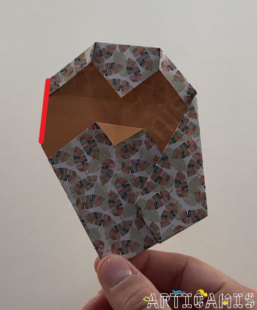 Step 16: Turn the model over and fold the left tip back.