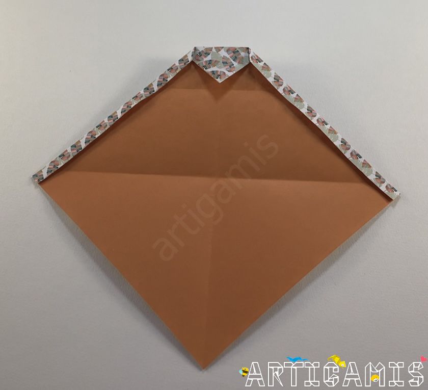 Step 6: Fold the top edges as shown.