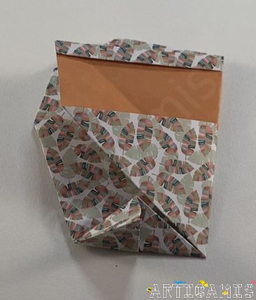 Step 15: Fold the tip. This will make your owl stand upright!