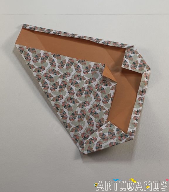 Step 11: Fold the right-hand side over the previous fold.